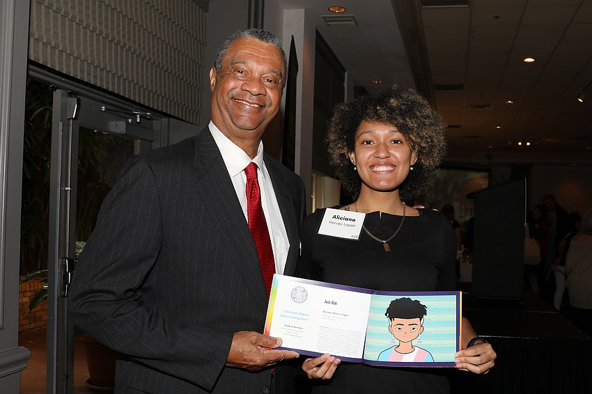 Judge Charles E. Williams with artist Aliciana Harvey-Lopez, who is a senior at Pine View School.