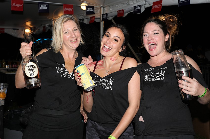 Serving up Sonny's BBQ are Leesa Merritt, Michelle Carben and Kara Lisa