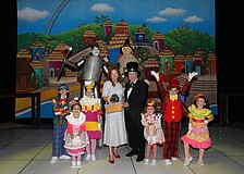 From Cirque Vertigo are the Tin Man Aydar Rakhmatullin,  Cowardly Lion Roma, Cooking for Wishes Co-Chair Terri Klauber with Luna staring as Toto, emcee Michael Kaluber, and performers Braden Baker, Faith Marie, Ainsley McLaughlin, Steffi Goldstone, Lincoln Rhoades and Farrah Moreno