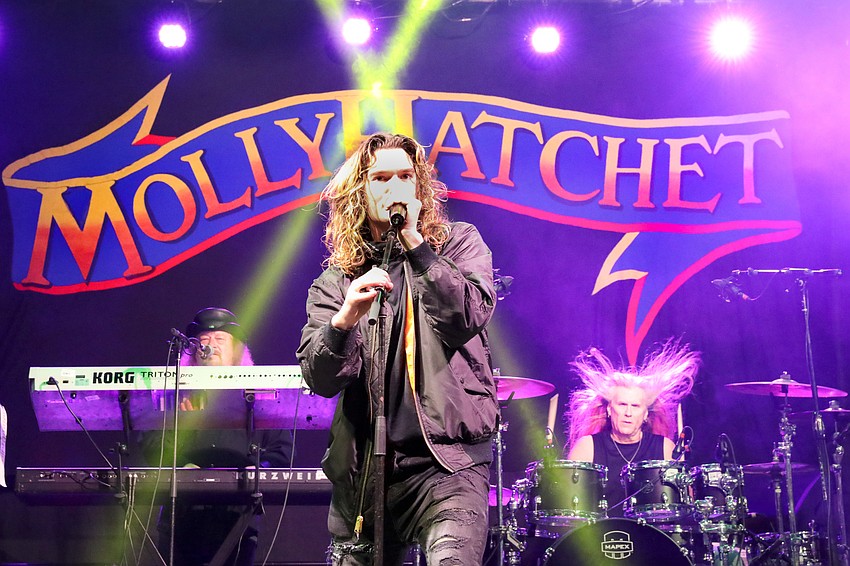 Molly Hatchet keyboardist, John Galvin, front man, Parker Lee, and drummer Shawn Beamer perform at the Thunder by the Bay kickoff party.