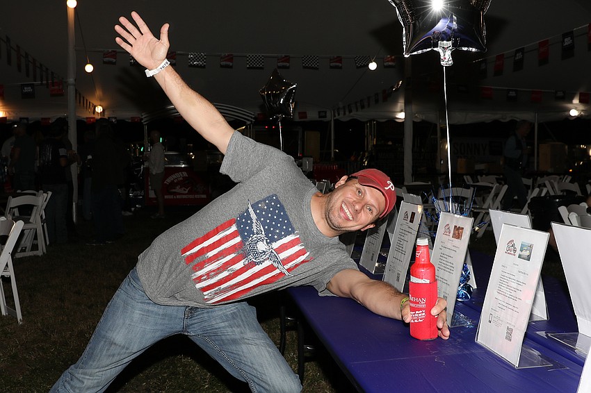 Gaetano Castiglione peruses the silent auction items.