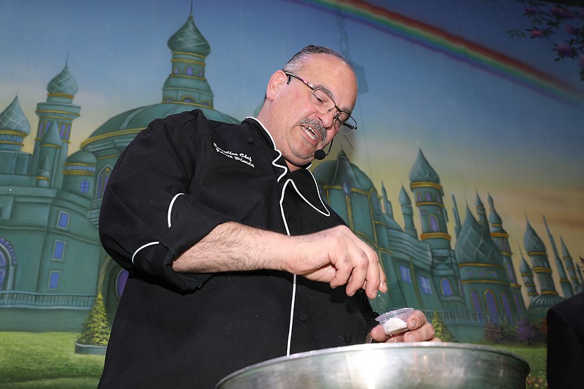 Michael's On East chef Jamil Pineda hosts an interactive dinner for 400 with table chefs following his lead.