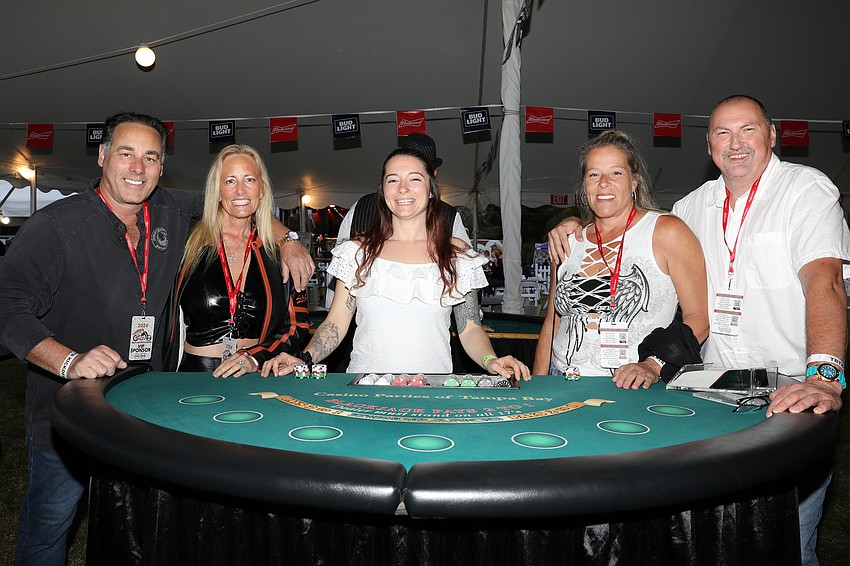 Larry and Lorraine Ziff, Darien Lincoln, and Jennifer and Shawn Anderson enjoy the gaming table.