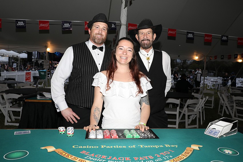 Brian Bell, Darien Lincoln, and Mark Goodpasture man the tables.