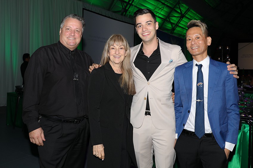 Dino and Elizabeth Klamson with their son, Jason, and his business partner Jeffrey Karasawa