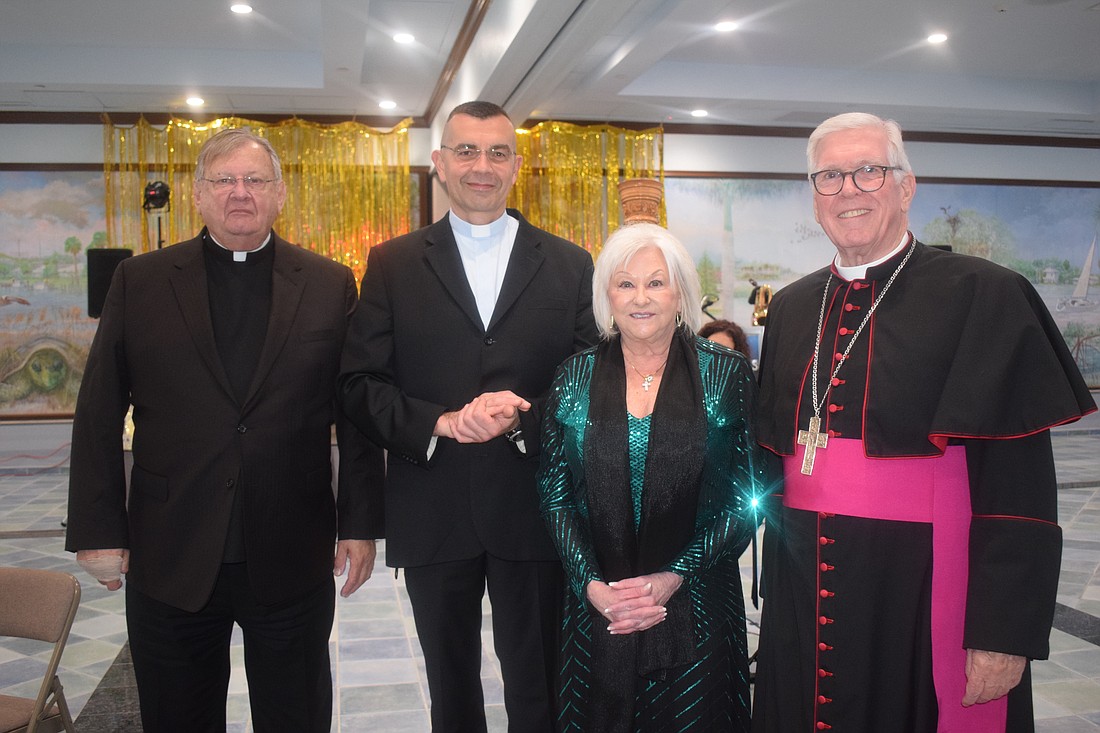 Fr. Phillip Schweda, Fr. Robert Dziedziak, Linda Olsen and Bishop Frank Dewane