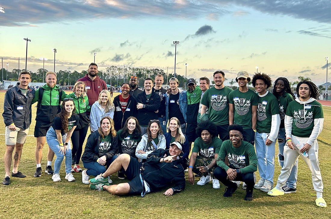 FPC track and field alumni with Coach David Halliday at the East Coast Classic on Feb. 23, which celebrated Halliday's 20 years as the program's head coach. Courtesy photo