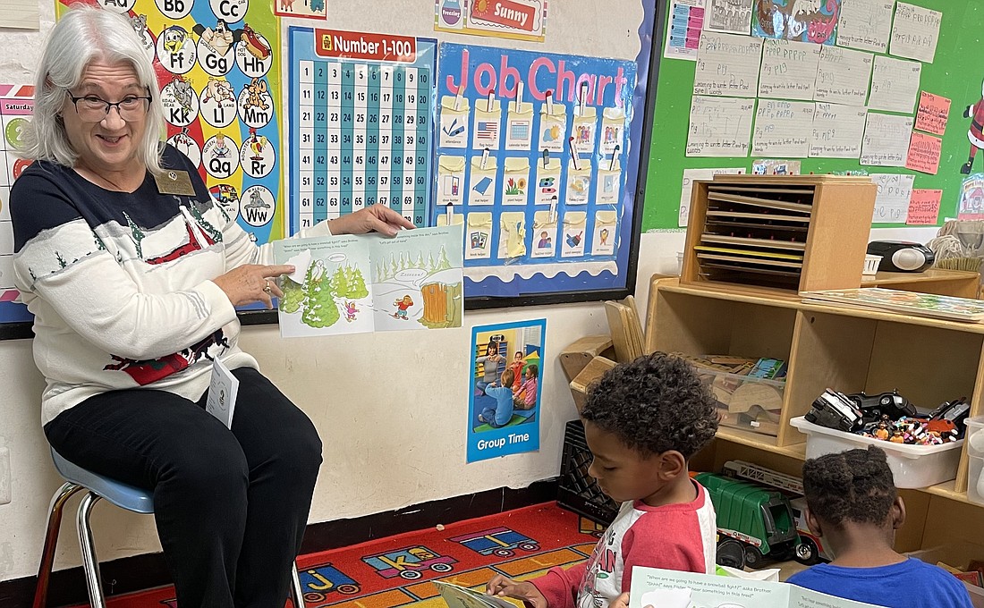 Read Learn Dream Co-chair Patty Casey reading to A New Beginnings' pre-kindergarten Class.