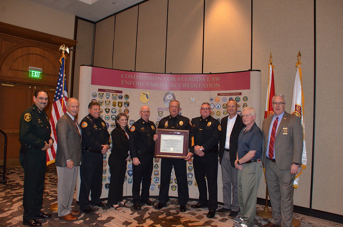 The Longboat Key Police Department accepted their accreditation from the Commission for Florida Law Enforcement Accreditation.