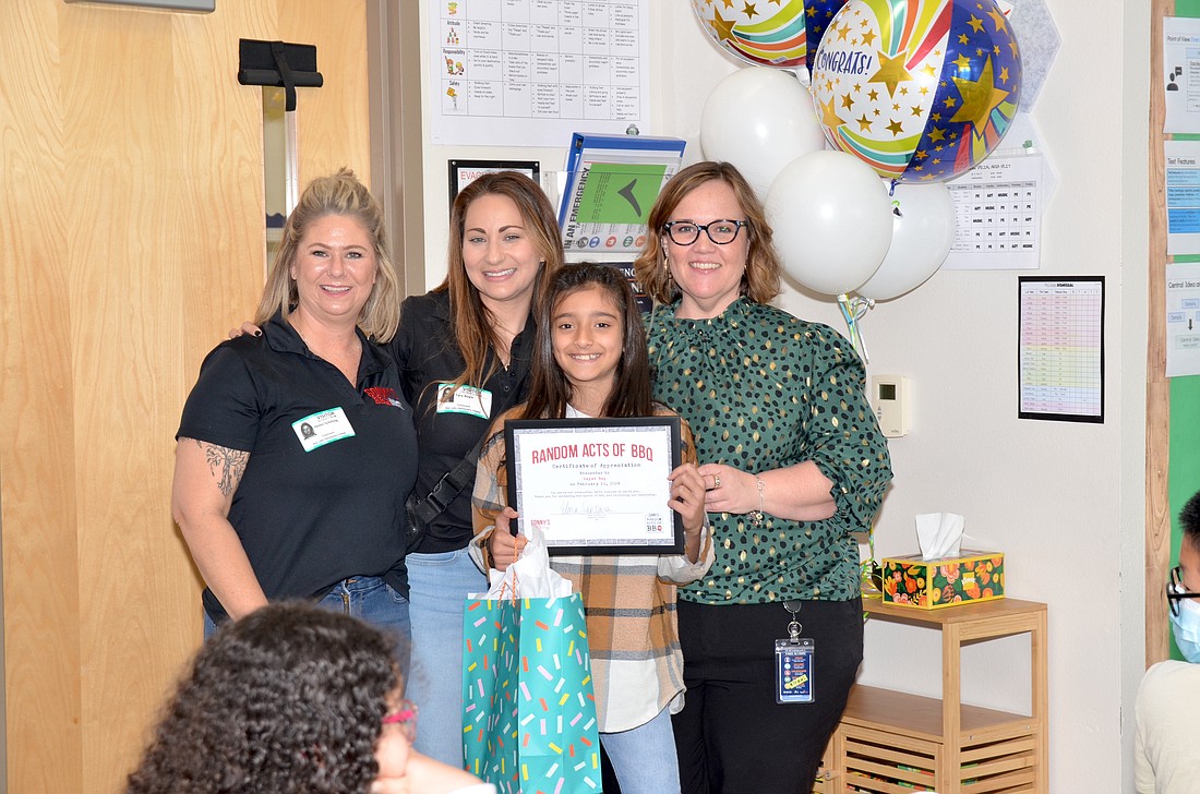 Sonny’s and Bay Lake Elementary School staff congratulated Aayat Beg for her random acts of kindness.