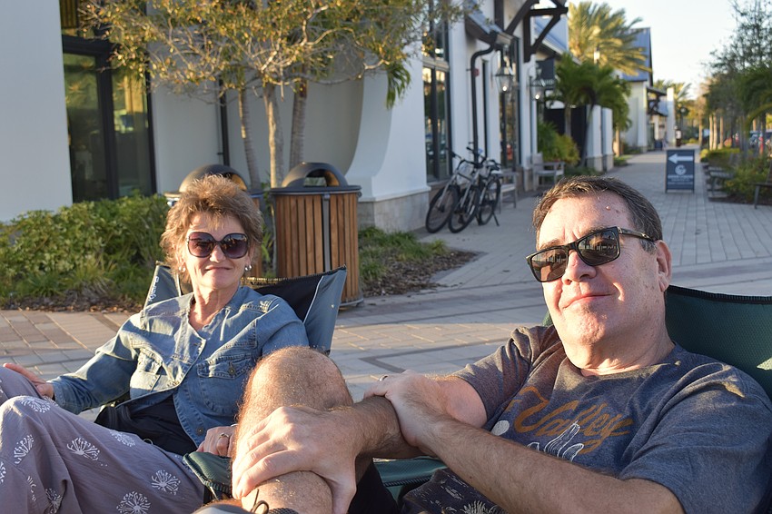 Lakewood Ranch residents Marilyn and Marty Munch attend shows at Waterside  Place regularly. They brought their own chairs and a pizza from the Good Liquid Brewing Company to enjoy Sights and Sounds on Feb. 27.