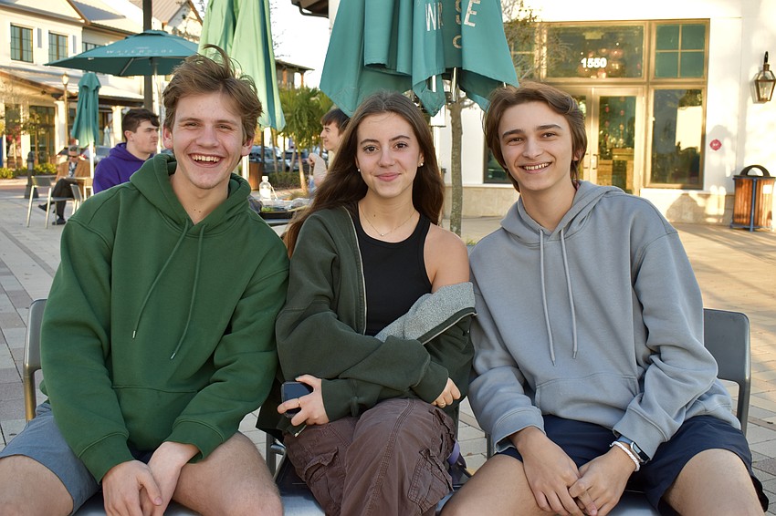 Out-of-Door Academy sophmore Evan Jarr, senior Ashlynn Calka and sophmore Kegan Gargano are at Sights and Sounds to watch their friends perform.