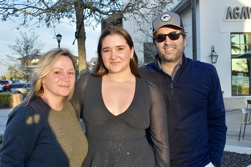 Cecilia and Kerry Gargano stand with their daughter Gavin, who is singing a solo in the show.