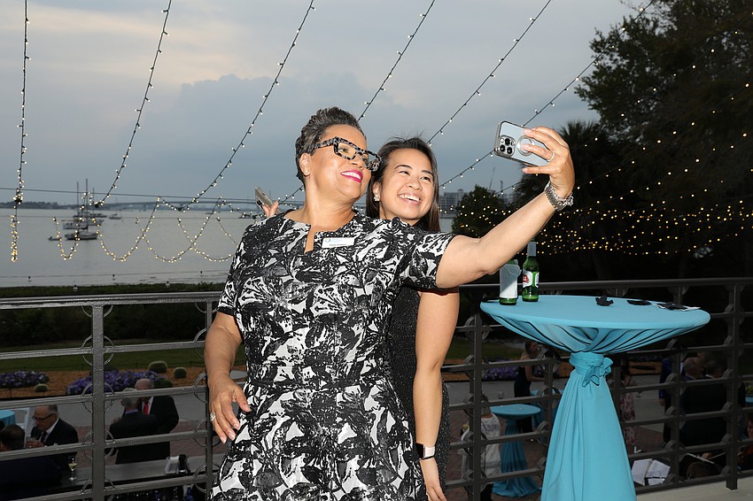 Tracie Cardwell and Jodel Velarde grab a Sarasota sunset selfie.