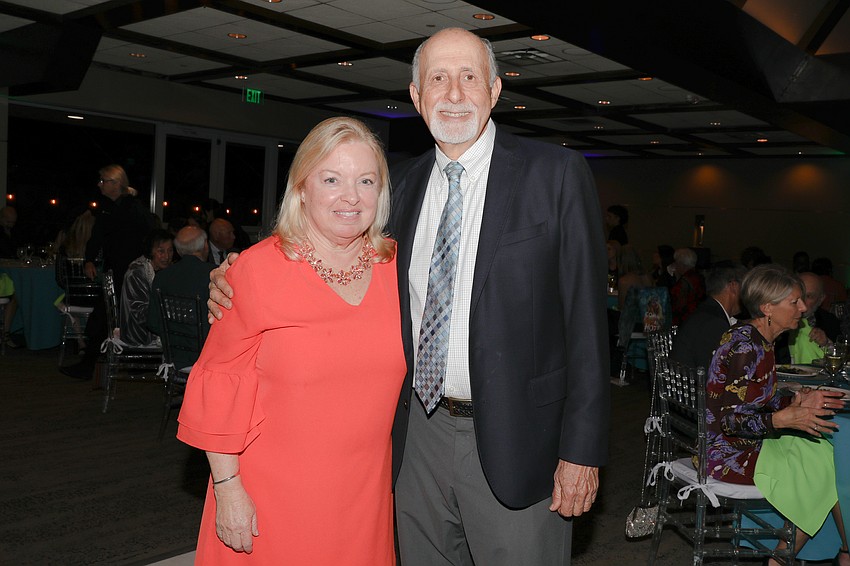 Senior Friendship Centers President and CEO Erin McLeod with past President and CEO Bob Carter