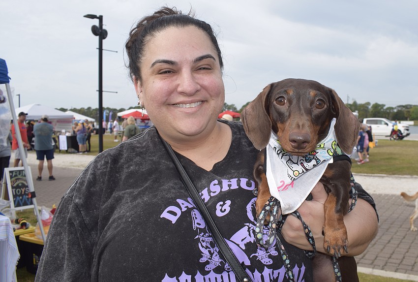 St. Petersburg's Milagros Raheb and her dog, Zamboni, are ready for a good time at the Southeastern Guide Dogs' Suncoast Walkathon.