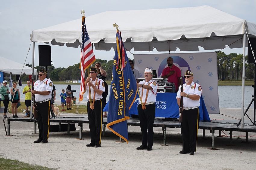 Braden River VFW Post 12055 members Chuck Slenker, Ken Green, Graham Ellis and Dave Daily present the colors during the National Anthem.
