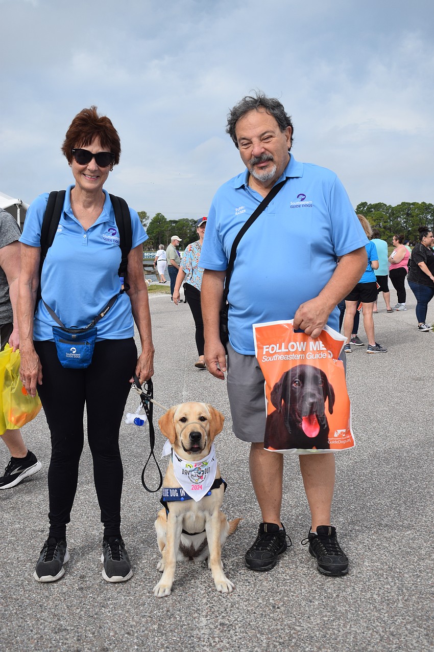 Country Club's Mollie and Marty Saia are first-time puppy raisers preparing Allie to start her training with Southeastern Guide Dogs.