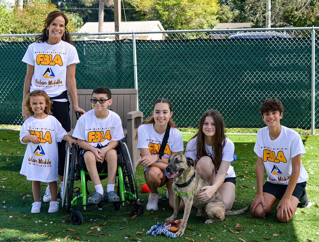 R. Dan Nolan Middle School Future Business Leaders of America advisor Stefani Heidenthal and her students hope their work with the Humane Society of Manatee County will lead to more dogs being adopted.