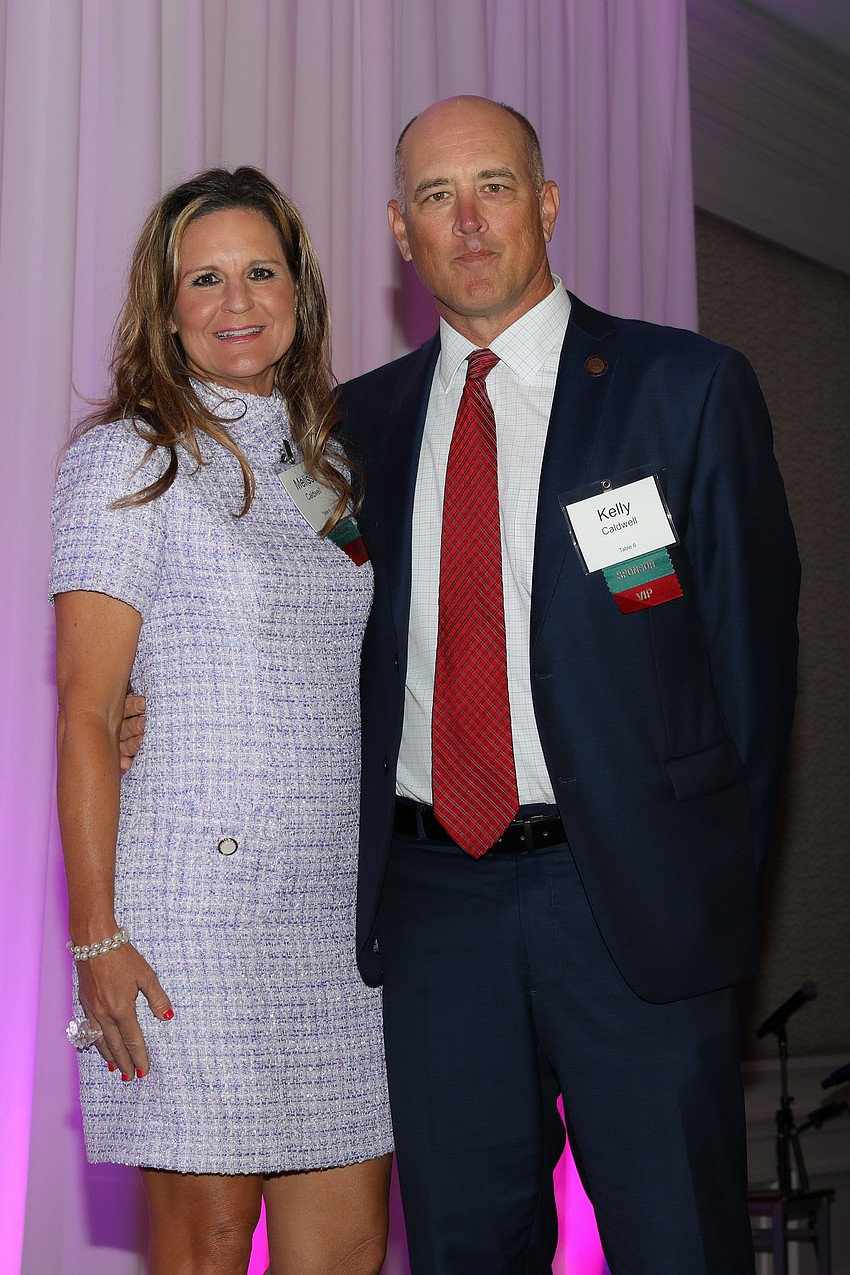 Kelly Caldwell, (right) had the audience laughing as he introduced Melissa as his 'support wife', but there was not a dry eye in the room as he shared his family's story about Tidewell's compassion while caring for his father.