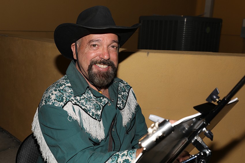 Sarasota Artist and personality Michael White provides drawings with his Sharpie markers.