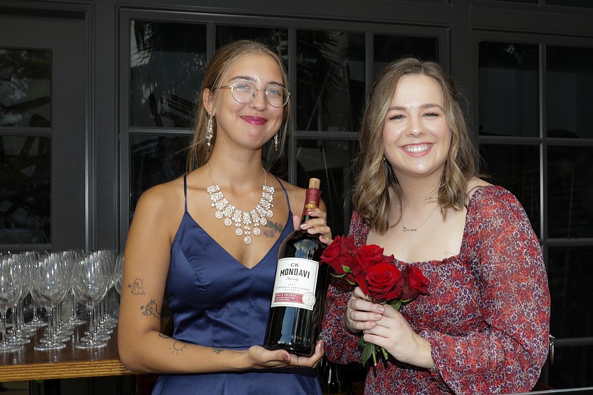 Kayla Mingus and Emilie Reed keep the guests hydrated.
