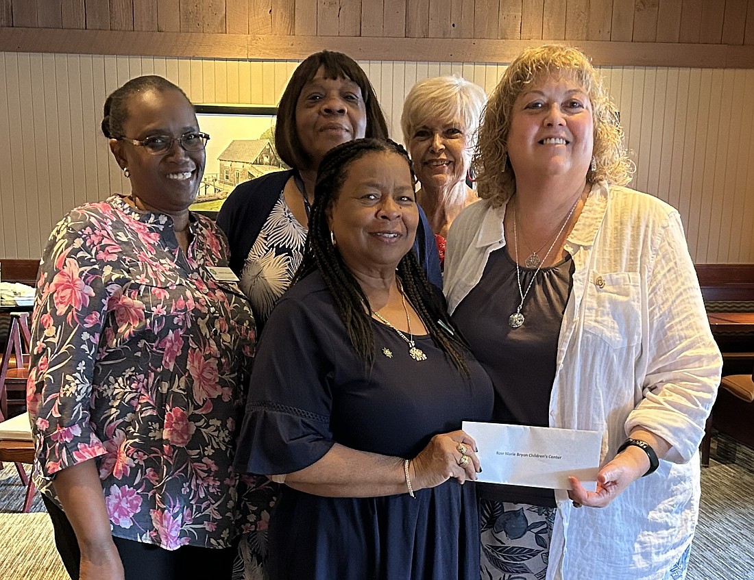 Janet Byrant (front), Executive Director-Rose Marie Byron Children's Center, receives a check from Laurie Kaye, president of Pilot Club of the Halifax Area. (Back row) Volunteers Janice Williams, Nancy Lawrence and Mary Johnson – all Pilot Club members. Courtesy photo
