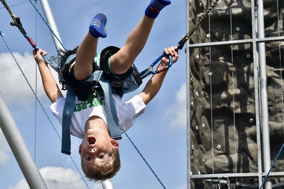 Liam Middleton, 6, does a backflip on the bungee trampoline.