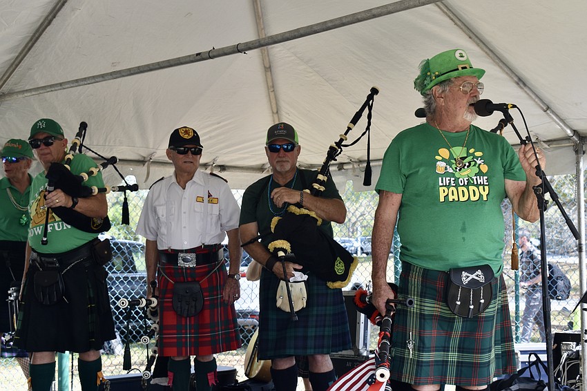Members of the Lion Rampant Pipe and Drum band perform for the crowd.