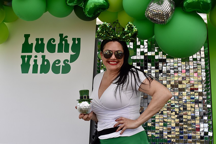 Krista Brock, owner of Oh What Fun Party Co., gives festivalgoers a photo op.