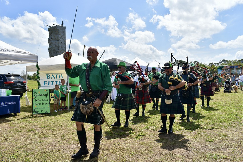 Bagpipe players lead the dogs in the Lucky Dog Parade at the 2024 Irish Celtic Festival.