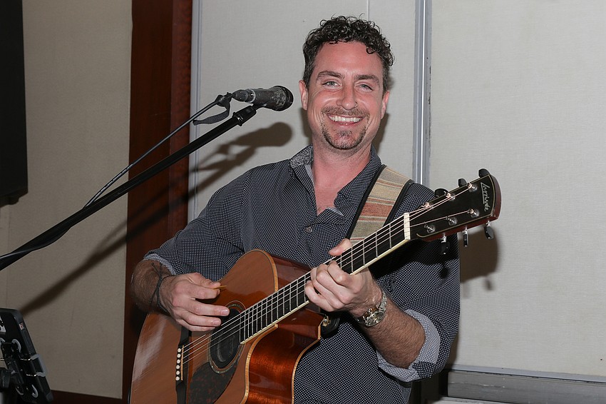 Guitarist Paul Fournier entertains during the cocktail hour.