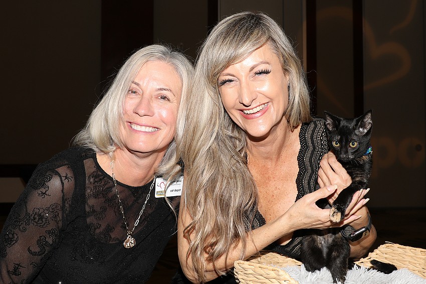 Executive Director of Cat Depot Susan Harris, with Kirsten Sponseller and kitten, Noel