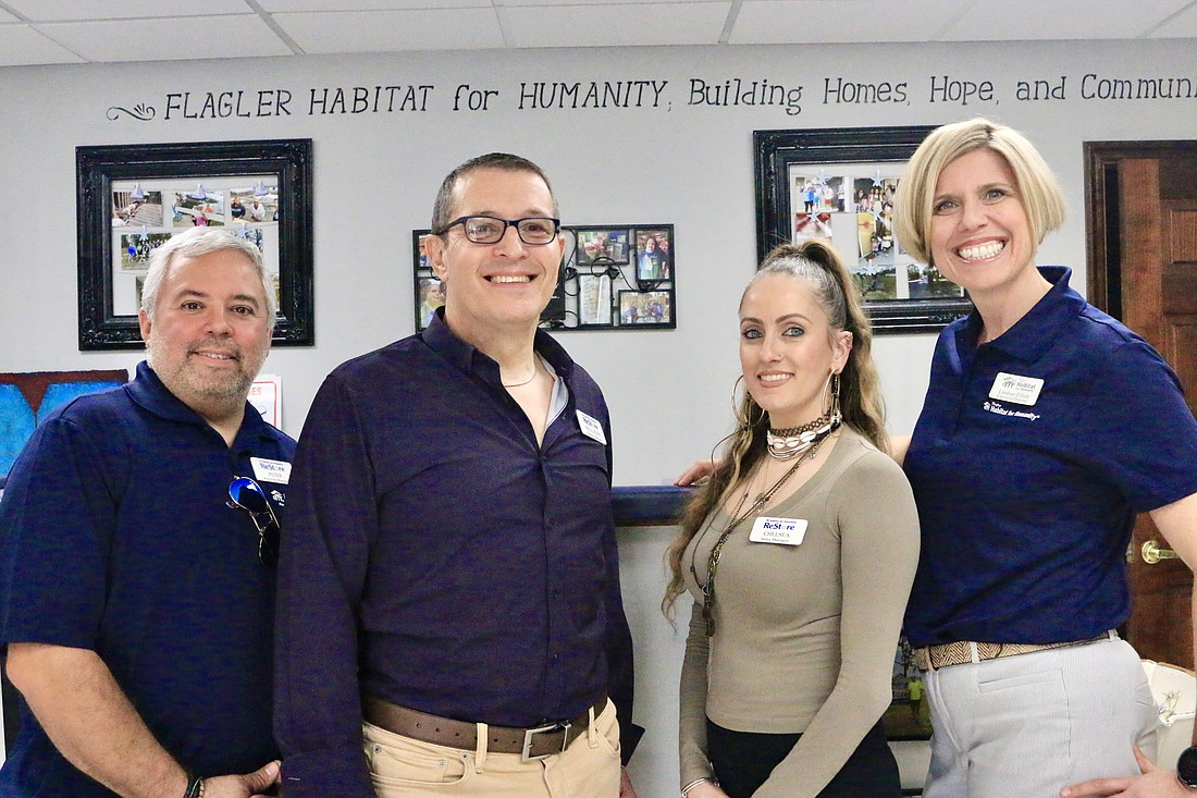 From left to right: Bunnell Restore manager Peter Ortiz, general manager Paul Hunt, Palm Coast restore manager Chelsea Oberle and Habitat for Humanity Flagler Executive Director Lindsay Elliott. Photo by Sierra Williams