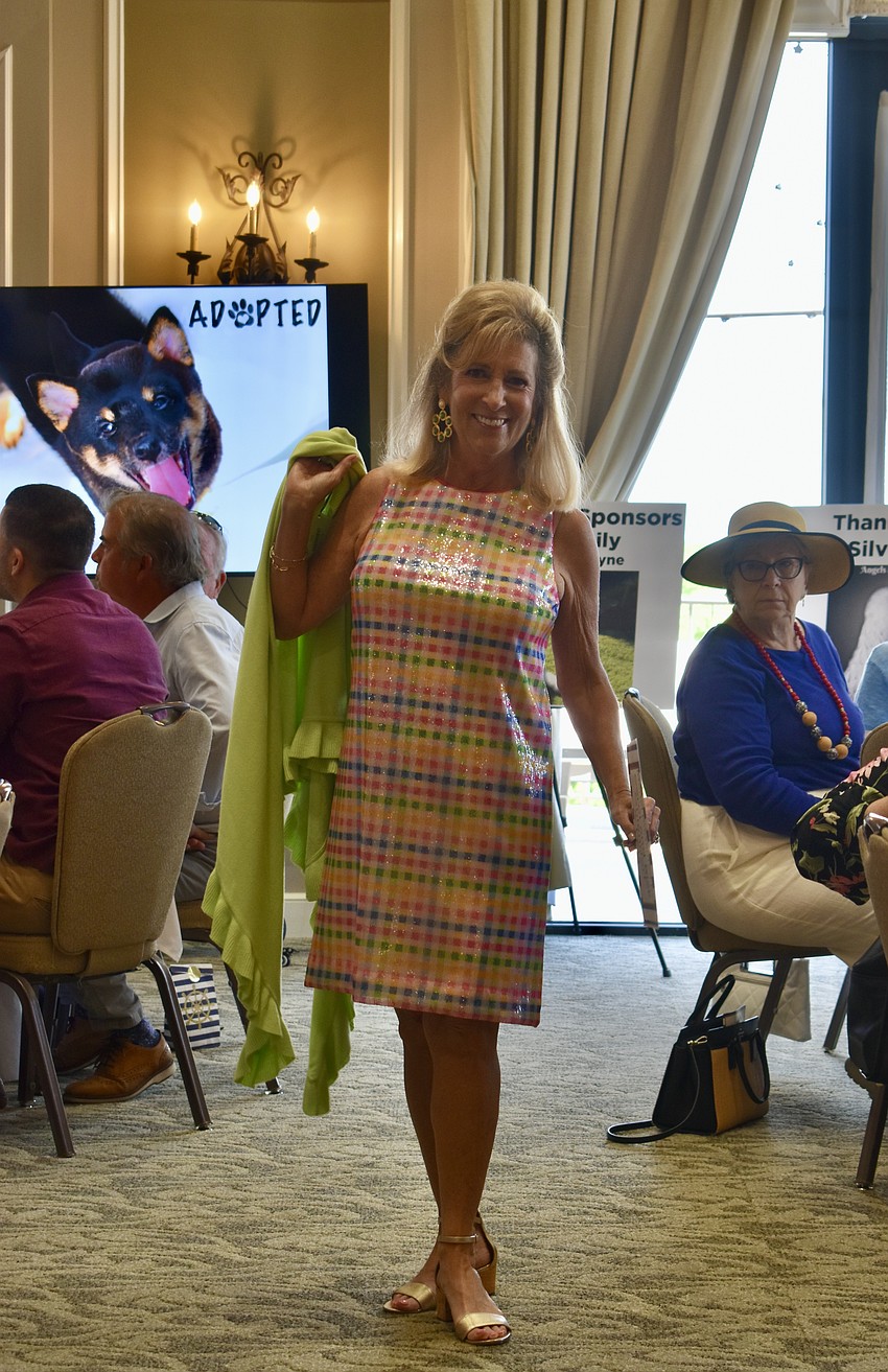 Jill Wellinger models for the Humane Society's Divas and Dogs fashion show.