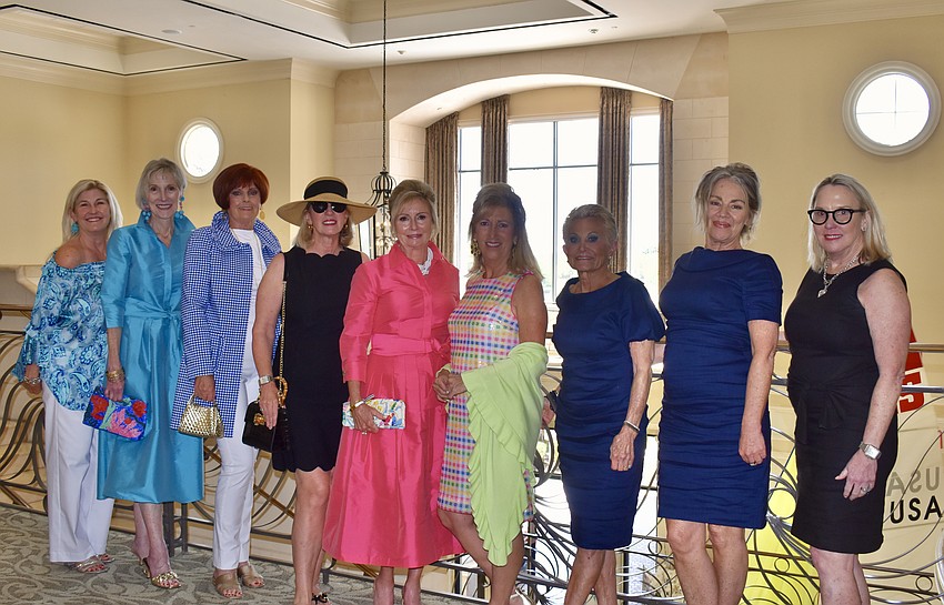 Debbie Allen, Stephenie Frasher, Cathy Adragna, Pamela Reilly, Susan Jenkins, Jill Wellinger, MaryJo Hansen, Kim Rummel and Gail Ward model the clothes provided by Sara Campbell.