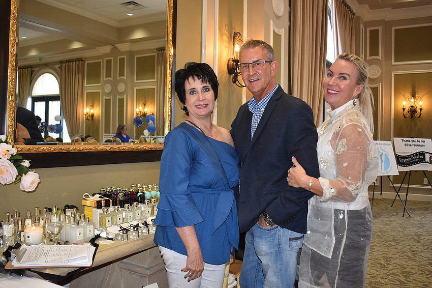 Patrice McGarrity, Jeff Hoffman and Katrin Zszhage are selling Jo Malone candles and cologne, then donating 10% of the proceeds to the Humane Society at Lakewood Ranch.