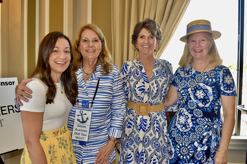 Veterinarian Leigh Samanowitz stands with board members Cindy Jackson, JoAnn Nicholas and Joanne Terwilliger.