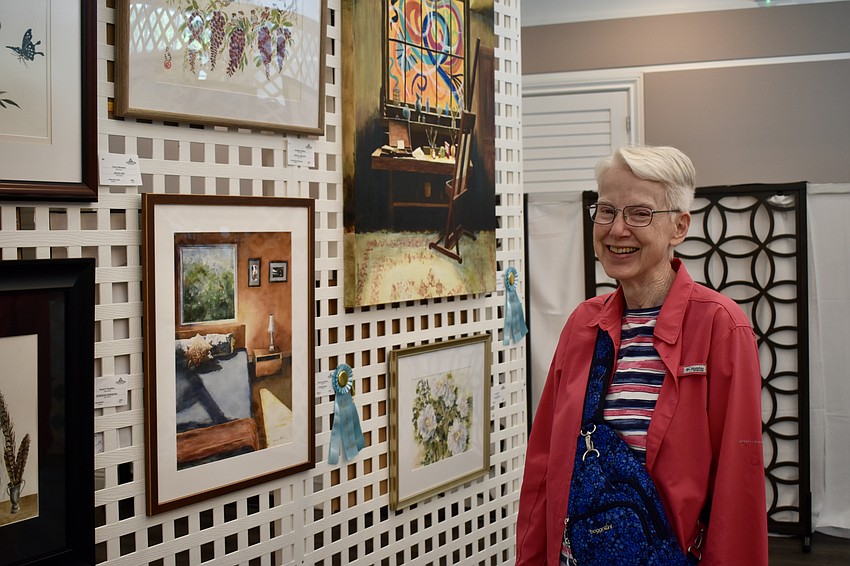 University Park resident Nancy Huck stops in on March 16 to view the art.