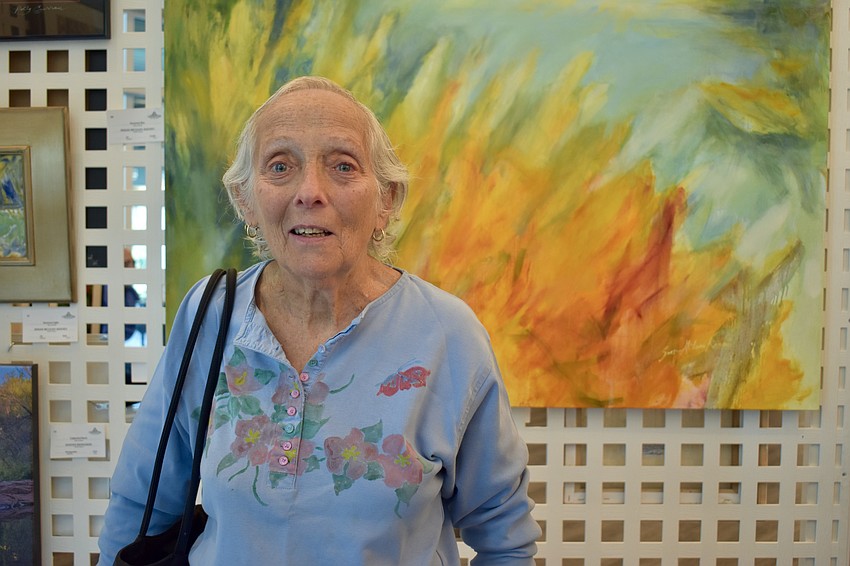 Palmer Ranch resident Barbara Lande is also an artist. She painted the shirt she's wearing after she spilled tomato sauce on it and couldn't get the stain out.