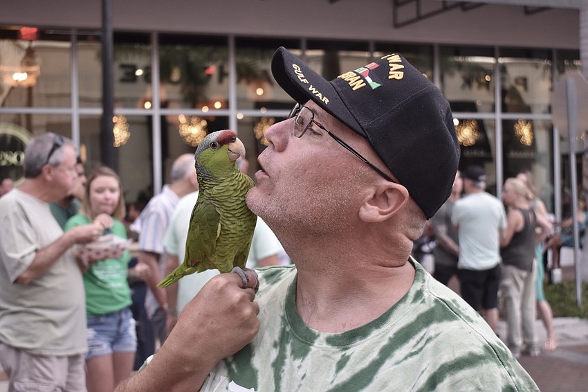 Valerie Wood's bird Taco (pictured with her brother, Parrish's Pohlen Lyle) brought a touch of green to the scene.