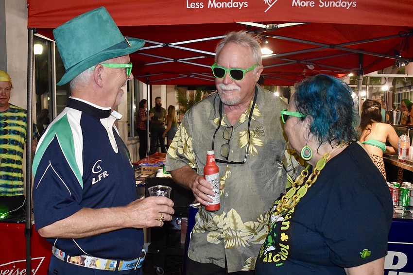 Gord Maclean, Charlie Bloom and Tracy Brice enjoy a chat.