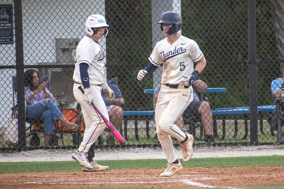 ODA senior Nolan Naese (5) scores a run against ISANP. Naese is one of the Thunder's leaders and is helping teach younger Thunder players how to play the right way.
