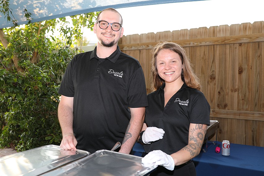 Jake Silver and Mackenzie Buechner from Duval's are almost ready to serve their special recipe of mac and cheese with black grouper and shrimp.