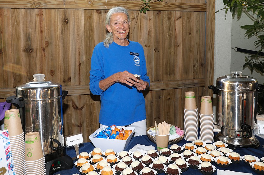 Mote Marine volunteer Lynn Cook is thrilled to run the Nothing Bundt Cake station.