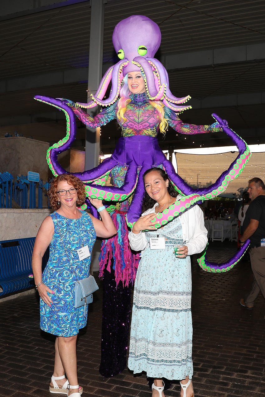 Beth Sanchez and Dahiana Torres with Lynn Sky in her 100-pound octopus costume.