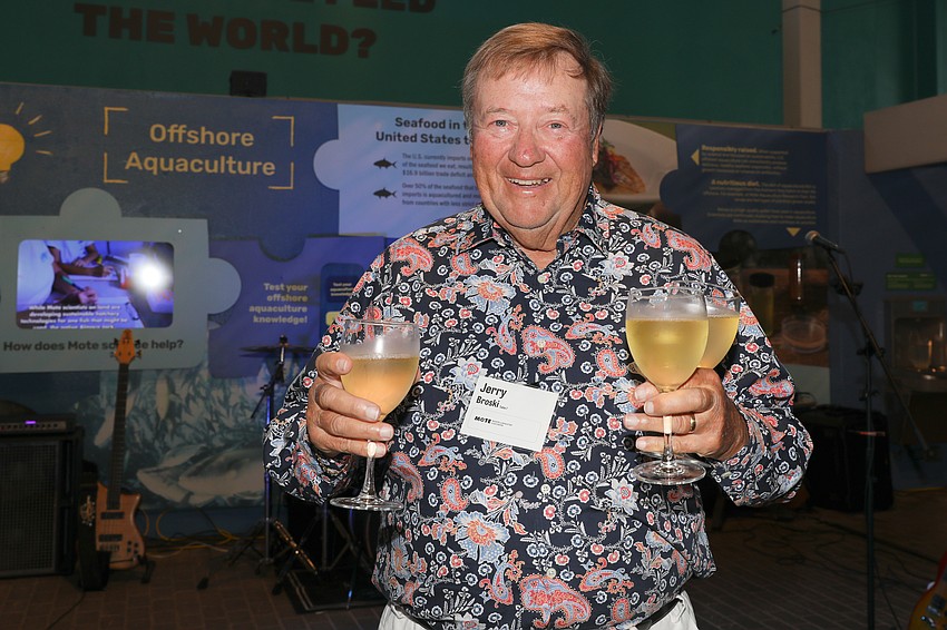 Jerry Broski gathers drinks for his table.