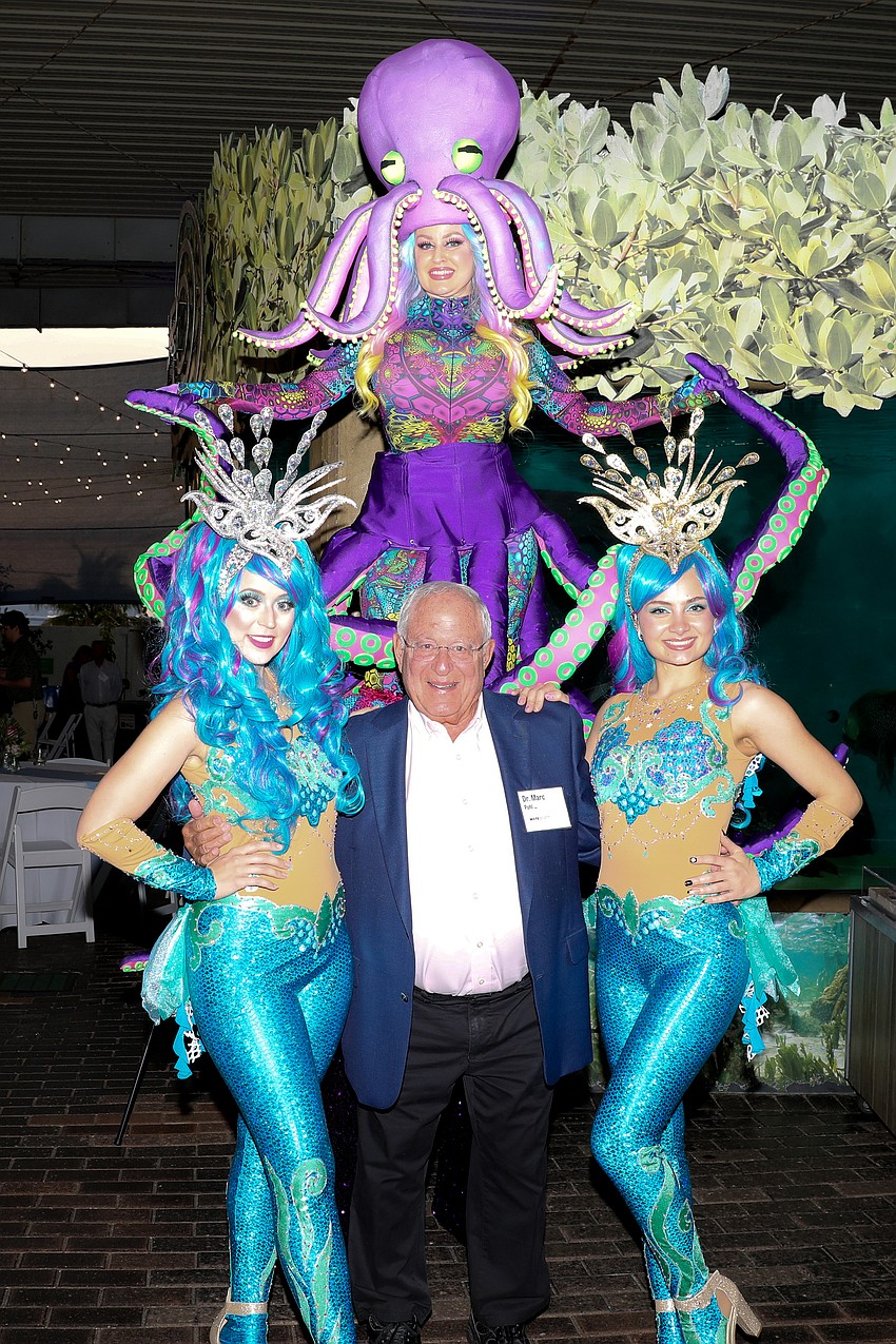 Dr. Marc Pohl gets his photo with Ray D., Lynn Sky, and Sheyla Maltese from Cirque Vertigo