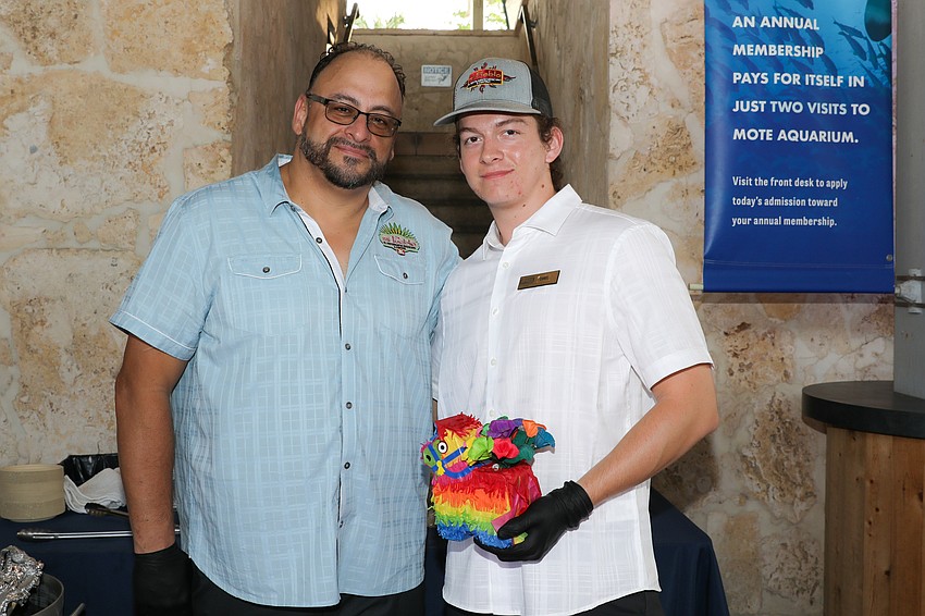 Bonifacio Caro and son, Daniel, are serving their famous Elote, or street corn, from Mi Pueblo.