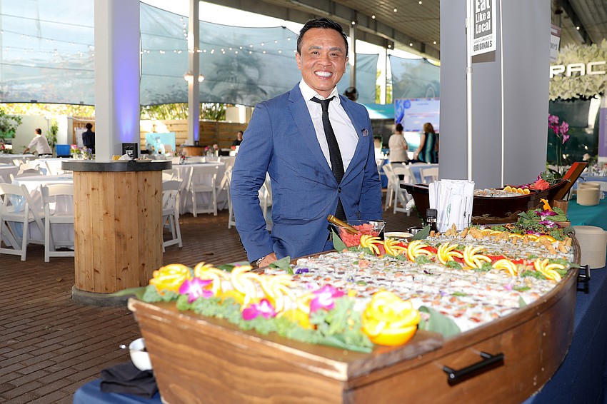 Veth Senenoi poses with his wildly popular sushi boat from Pacific Rim.